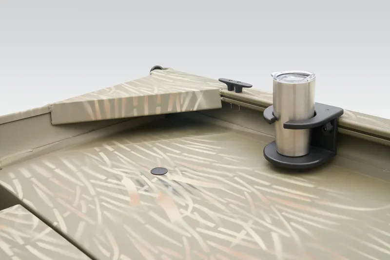 Slide: The Image of 2023 Tracker Grizzly 1654 T Sportsman boat interior with camouflage design and cup holder. - 40