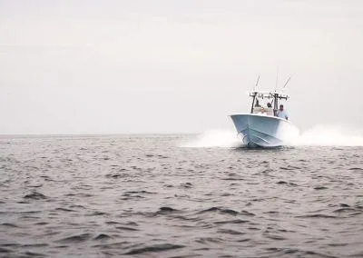 Slide: The Image of 2025 Contender 30 ST boat speeding on open water. - 3