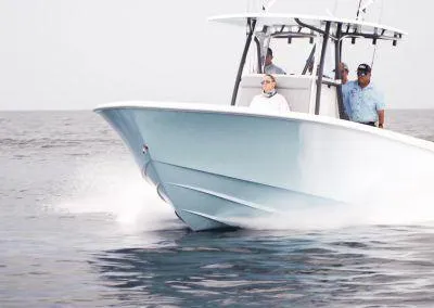 Slide: The Image of 2025 Contender 30 ST boat cruising on open water. - 4