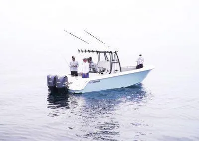 Slide: The Image of 2025 Contender 30 ST fishing boat with people on calm water. - 6