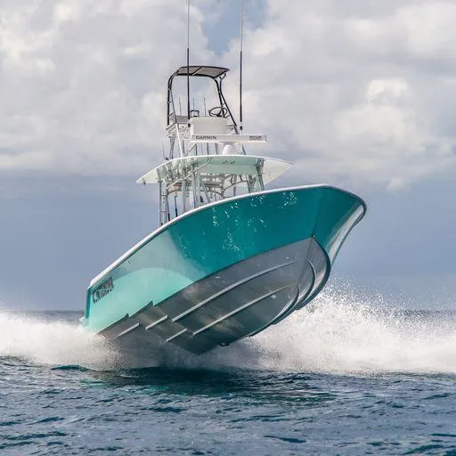 Slide: The Image of 2025 Contender 39ST boat speeding on water. - 1