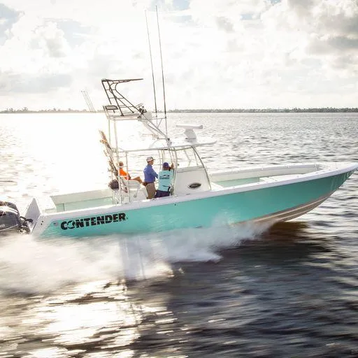 Slide: The Image of 2025 Contender 39ST boat cruising on open water. - 2