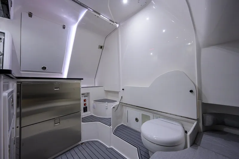 Slide: The Image of 2025 Contender 39FA boat interior bathroom with modern fixtures and sleek design. - 15