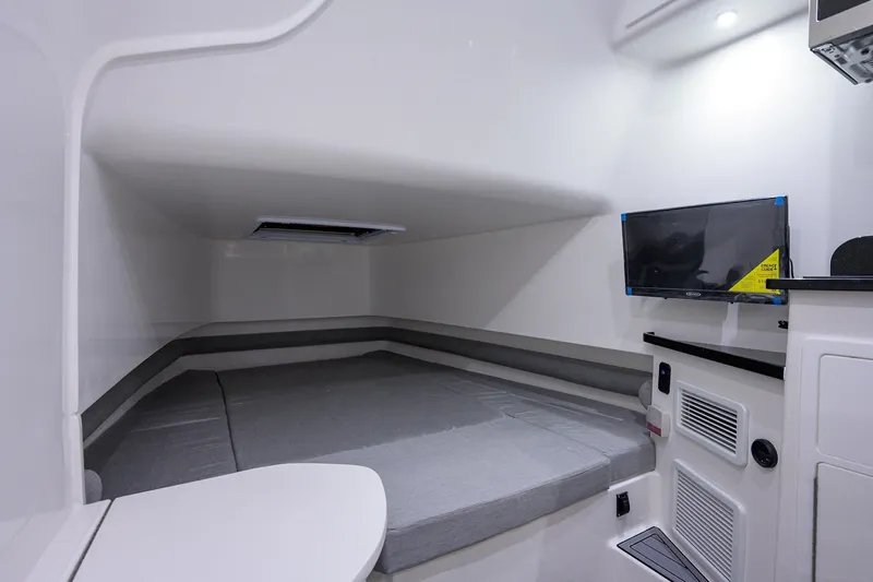 Slide: The Image of Interior cabin of 2025 Contender 39FA boat with bed and TV. - 16