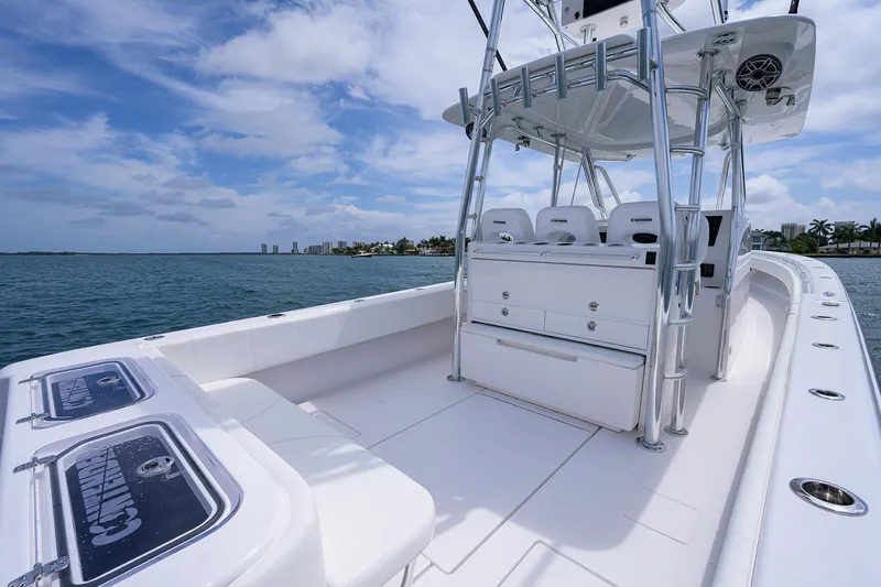 Slide: The Image of Contender 39FA 2025 model boat interior with ocean view and clear sky. - 21
