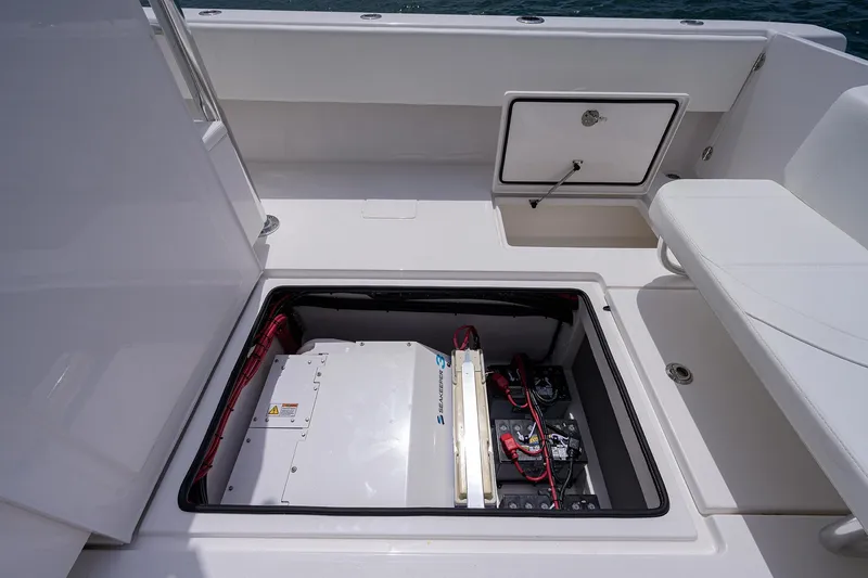 Slide: The Image of Contender 39FA 2025 boat with open hatch revealing Seakeeper 3 stabilizer and battery compartment. - 25