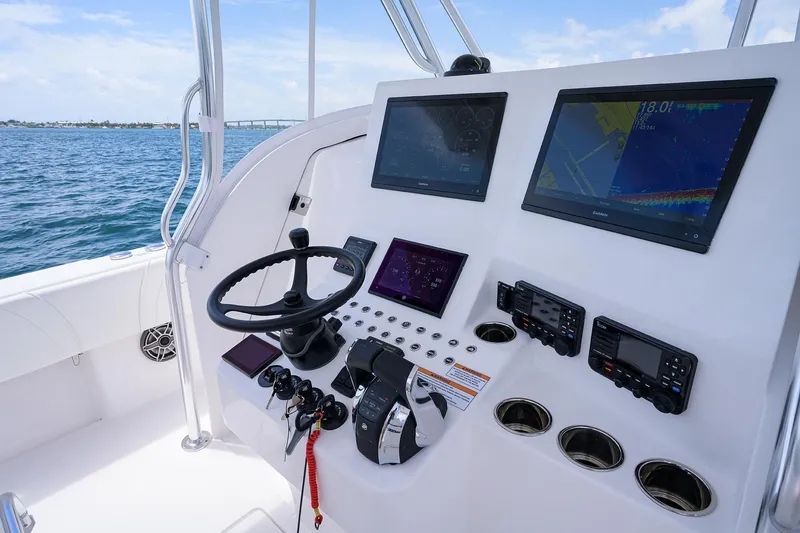 Slide: The Image of Contender 39FA 2025 boat dashboard with advanced navigation and control systems. - 29