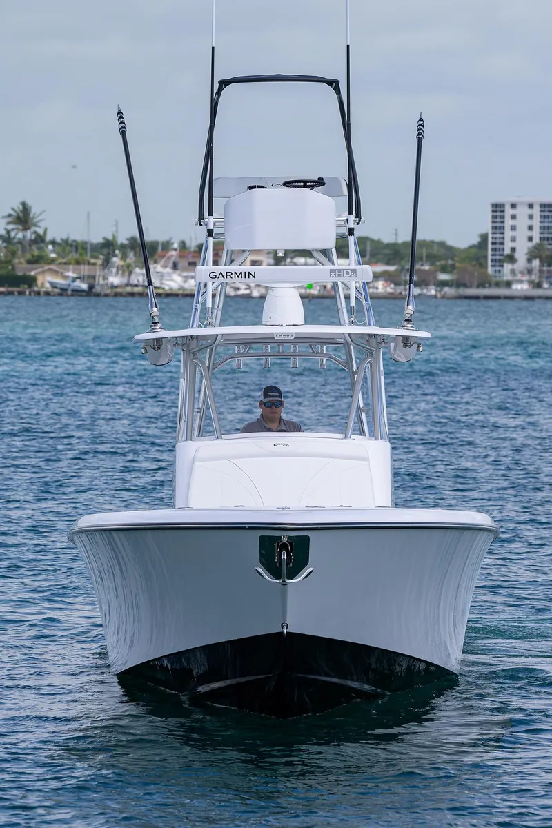 Slide: The Image of Front view of 2025 Contender 39FA boat on water. - 5