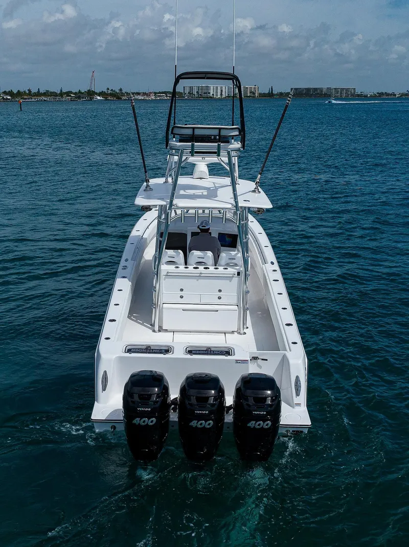 Slide: The Image of 2025 Contender 39FA boat with quad 400 Verado engines on the water. - 6