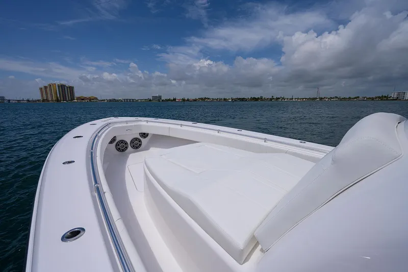 Slide: The Image of Contender 39FA 2025 model boat on water with city skyline in background. - 9