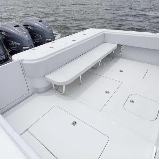 Slide: The Image of Contender 44FA 2025 boat with spacious deck and twin outboard engines. - 15