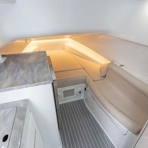 Slide: The Image of Interior cabin of 2025 Contender 44FA boat with seating and sleeping area. - 19