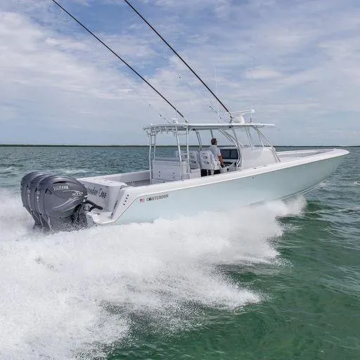 Slide: The Image of 2025 Contender 44FA boat cruising on open water. - 3