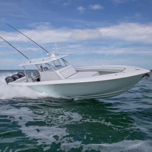 Slide: The Image of 2025 Contender 44FA boat cruising on open water. - 4