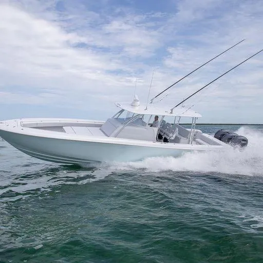 Slide: The Image of 2025 Contender 44FA boat cruising on open water. - 5