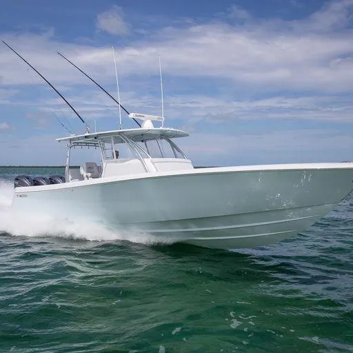 Slide: The Image of 2025 Contender 44FA boat cruising on open water. - 8