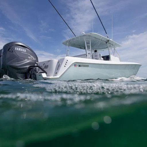 Slide: The Image of 2025 Contender 44FA boat with Yamaha XTO engine on the water. - 9