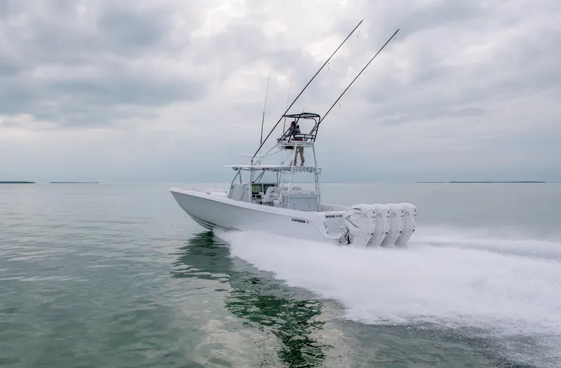 Slide: The Image of 2025 Contender 44CB boat speeding on open water. - 1