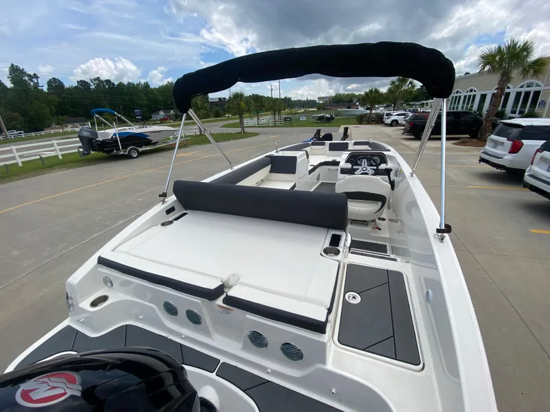 Slide: The Image of 2022 Bayliner DX2000 boat with spacious seating and modern design. - 11