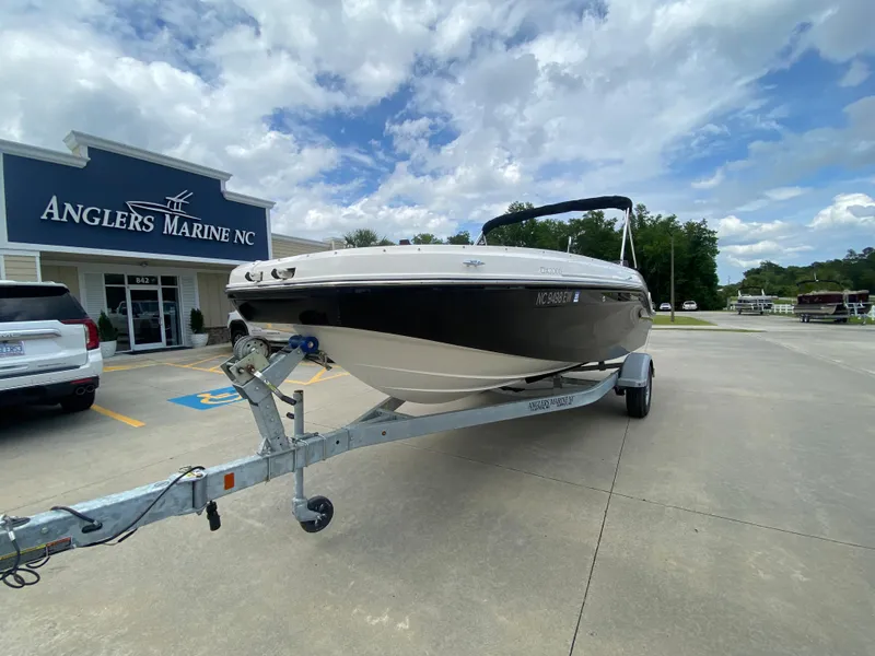 Slide: The Image of 2022 Bayliner DX2000 boat on trailer at Anglers Marine NC dealership. - 2