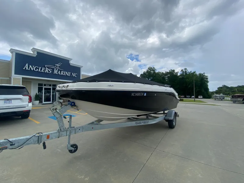 Slide: The Image of 2022 Bayliner DX2000 boat on trailer at Anglers Marine NC dealership. - 7