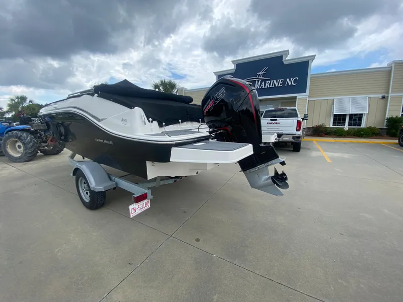 Slide: The Image of 2022 Bayliner DX2000 boat on trailer at dealership. - 9