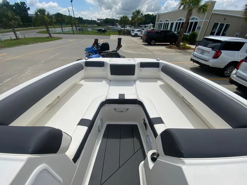 Slide: The Image of 2022 Bayliner DX2000 boat interior with spacious seating and modern design. - 25
