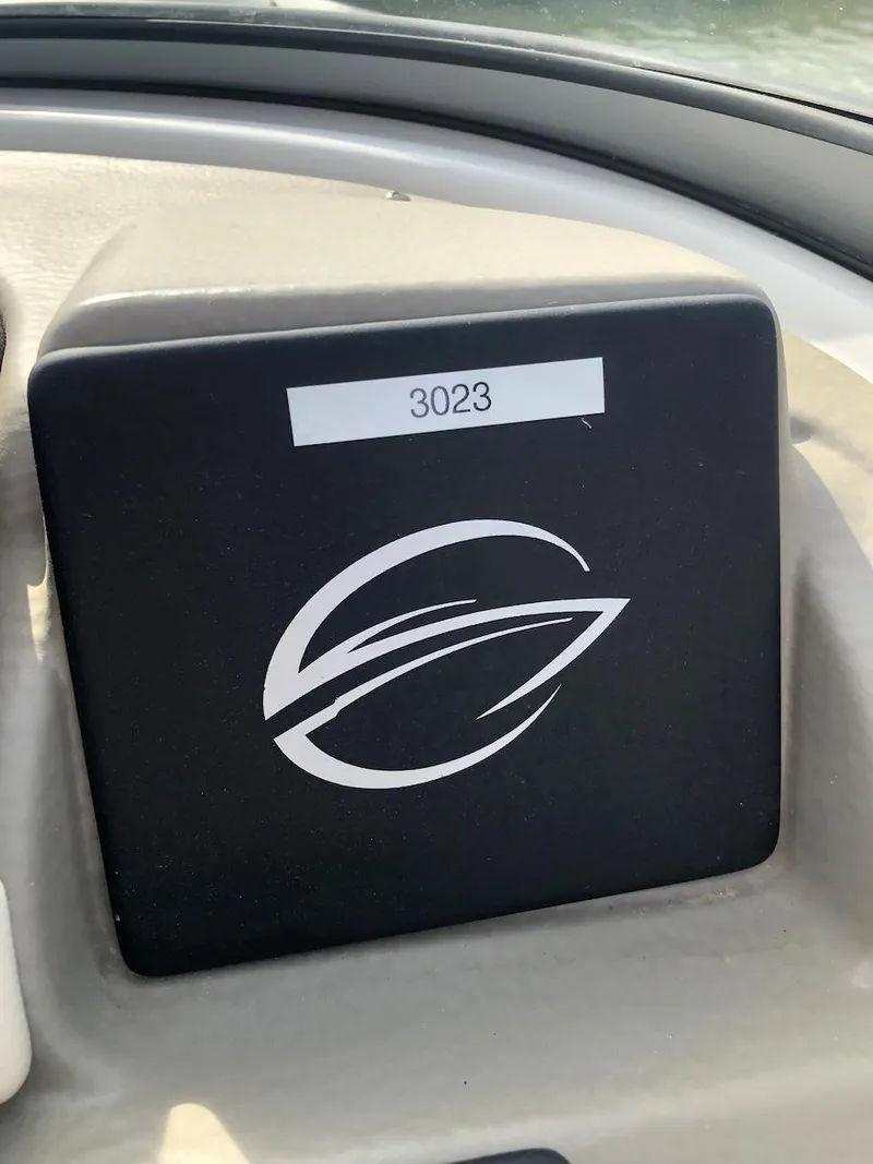 Slide: The Image of 2023 Crownline E 215 XS dashboard with logo and number 3023. - 7