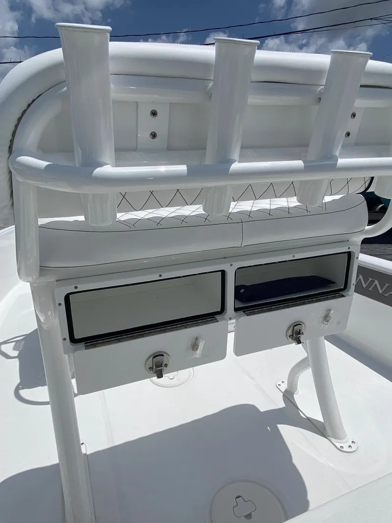 Slide: The Image of 2023 Savannah 190IS boat with rod holders and storage compartments. - 14