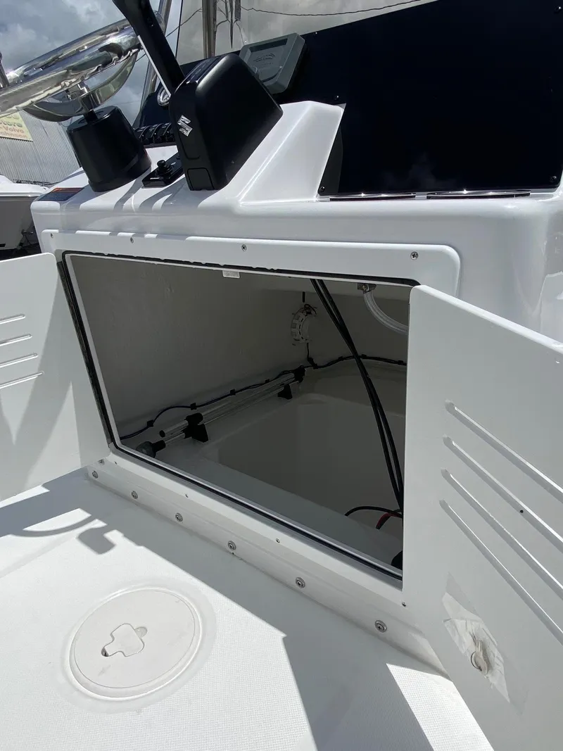 Slide: The Image of 2023 Savannah 190IS boat storage compartment with open hatch. - 15