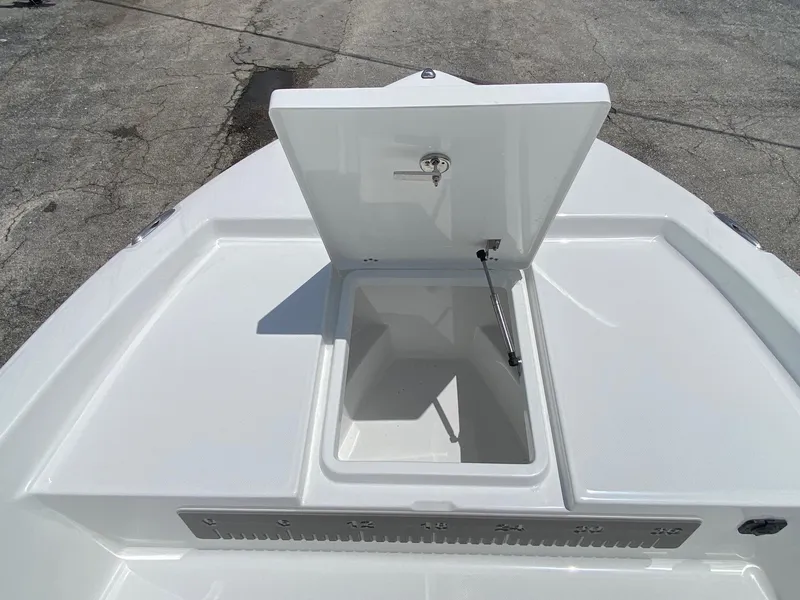 Slide: The Image of 2023 Savannah 190IS boat with open storage compartment. - 16