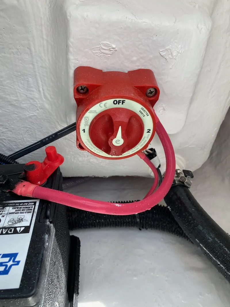 Slide: The Image of Red battery switch in a 2023 Savannah 190IS boat. - 20