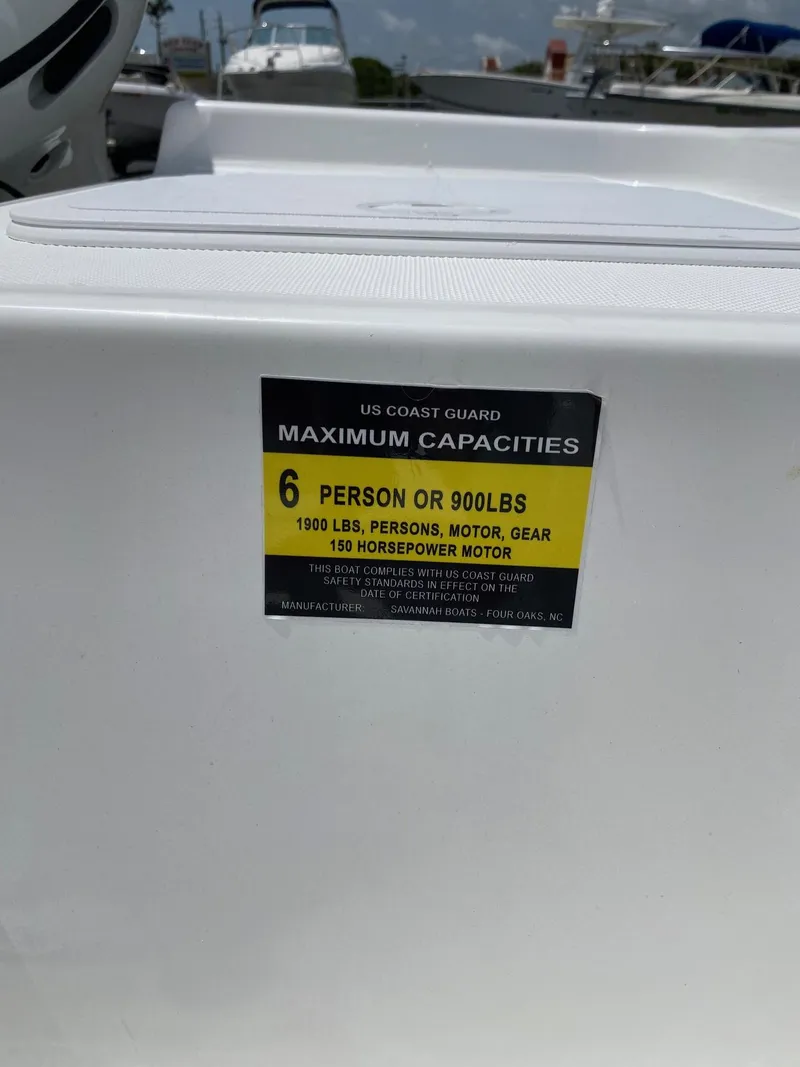 Slide: The Image of 2023 Savannah 190IS boat capacity label, 6 persons or 900 lbs, 150 horsepower motor. - 21