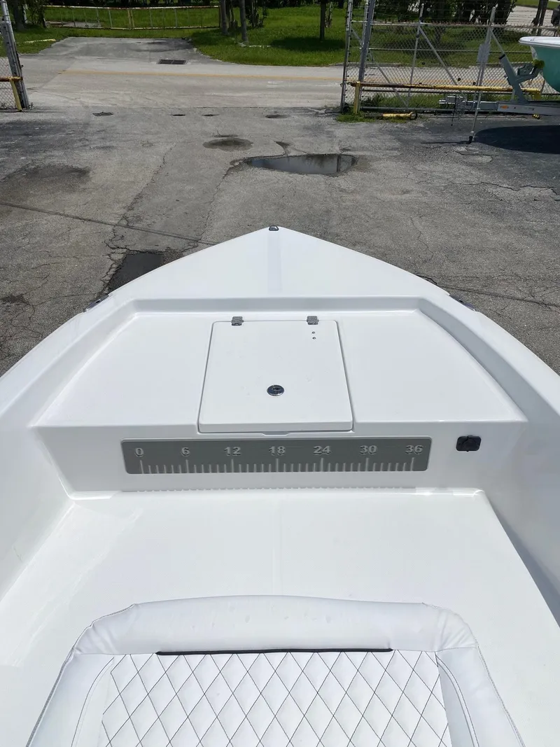 Slide: The Image of 2023 Savannah 190IS boat bow with storage compartment and measuring scale. - 7