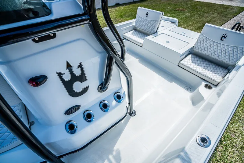 Slide: The Image of Interior of 2021 Catalyst 2300 BAY boat with white seating and black accents. - 10