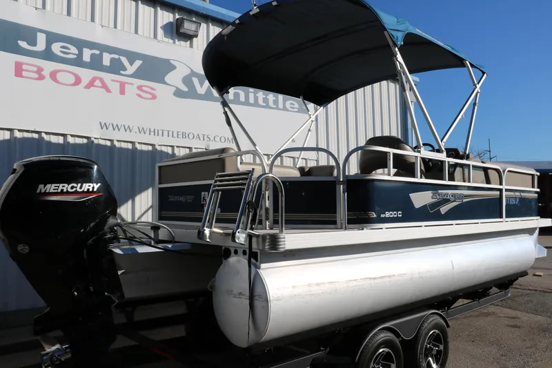 Slide: The Image of 2021 Ranger RP200C pontoon boat with Mercury outboard motor at Jerry Whittle Boats. - 2