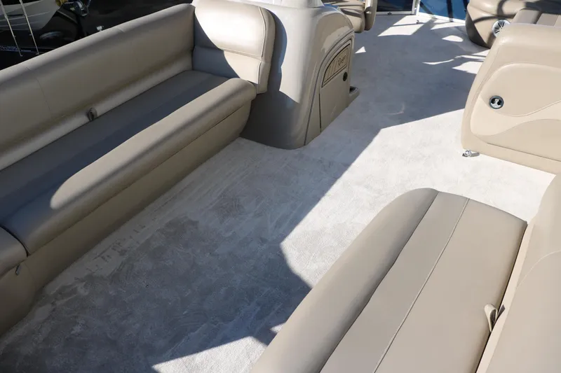 Slide: The Image of Interior of a 2021 Ranger RP200C pontoon boat with beige seating. - 21