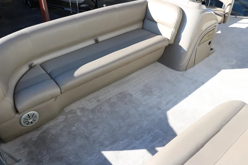 Slide: The Image of 2021 Ranger RP200C boat interior with beige seating and carpet. - 22
