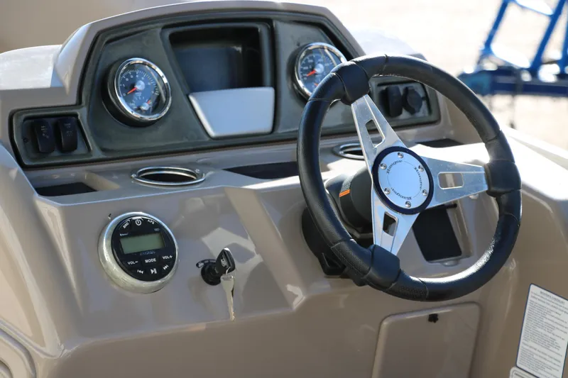 Slide: The Image of Steering console of a 2021 Ranger RP200C boat with gauges and controls. - 29