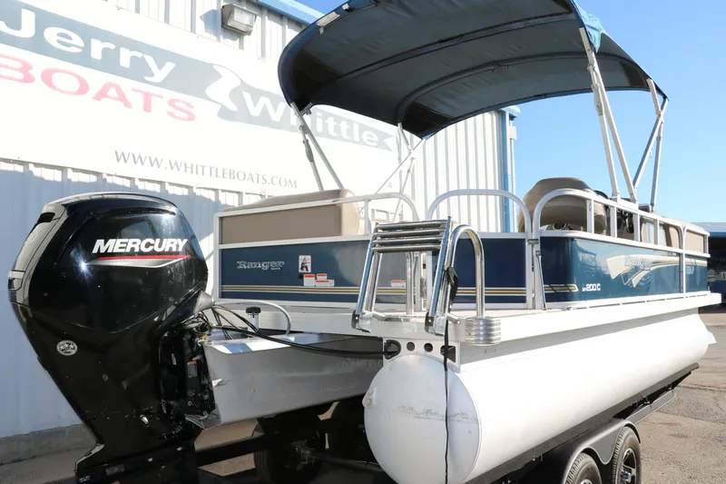 Slide: The Image of 2021 Ranger RP200C pontoon boat with Mercury outboard motor at Jerry Whittle Boats. - 3
