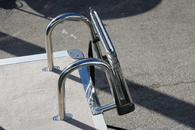 Slide: The Image of 2021 Ranger RP200C boat ladder and railing on deck. - 31