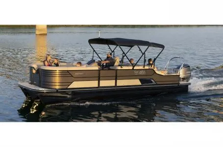Slide: The Image of 2023 SunCatcher Elite 326SS pontoon boat cruising on a lake. - 15