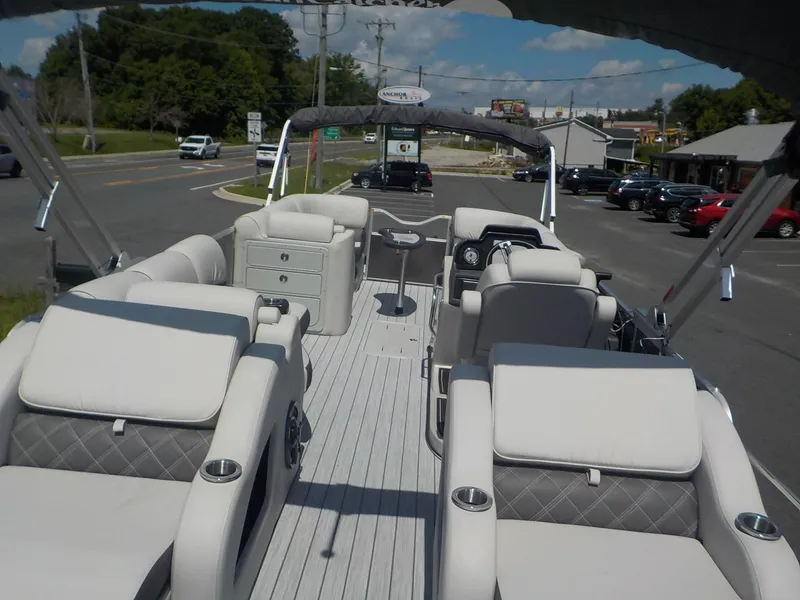 Slide: The Image of 2023 SunCatcher Elite 326SS pontoon boat with luxurious seating and modern amenities. - 19