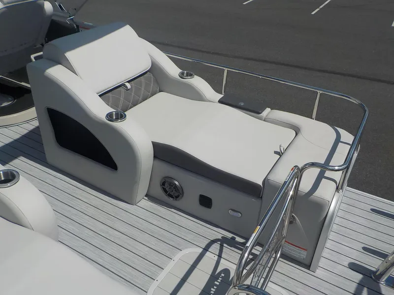 Slide: The Image of 2023 SunCatcher Elite 326SS boat with luxurious seating and cup holders. - 20
