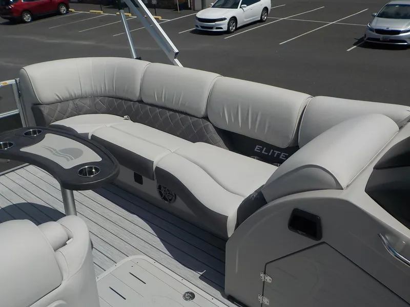 Slide: The Image of 2023 SunCatcher Elite 326SS boat interior with luxurious seating and cup holders. - 22