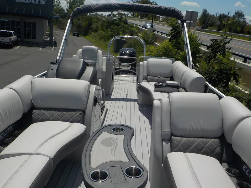 Slide: The Image of 2023 SunCatcher Elite 326SS pontoon boat with luxurious seating and modern design. - 24