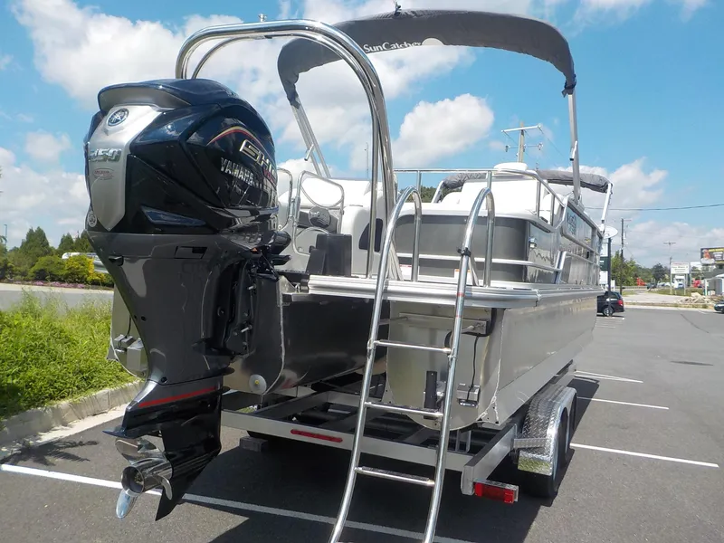 Slide: The Image of 2023 SunCatcher Elite 326SS pontoon boat with Yamaha outboard motor. - 4