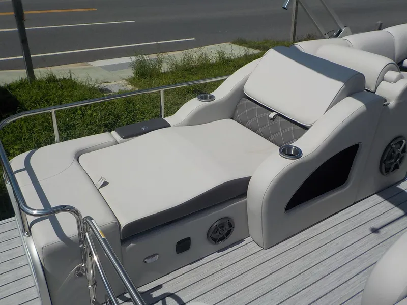 Slide: The Image of 2023 SunCatcher Elite 326SS boat with luxurious seating and cup holders. - 5