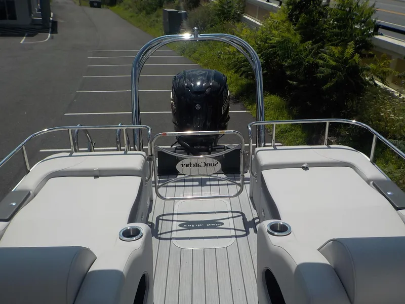Slide: The Image of 2023 SunCatcher Elite 326SS pontoon boat with rear seating and outboard motor. - 6