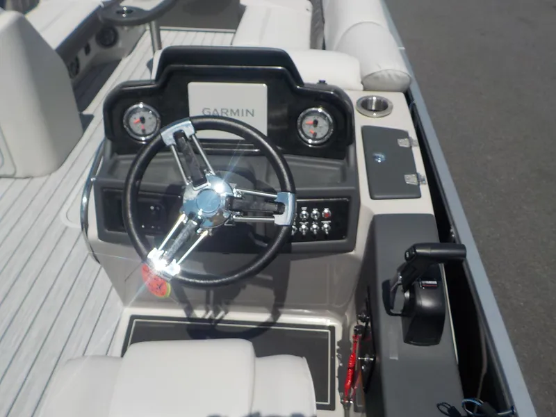 Slide: The Image of 2023 SunCatcher Elite 326SS boat dashboard with Garmin navigation system. - 8